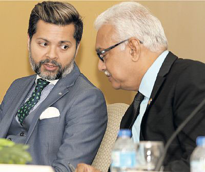 Acting Chief Medical Officer Dr Vishwanath Partapsingh, left and Health Minister Terrence Deyalsingh at Wednesday’s press conference.
