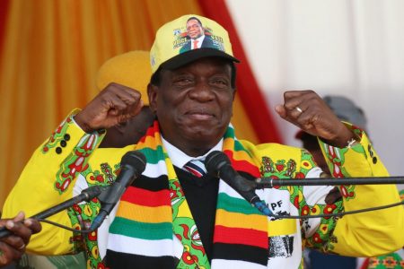 President Emmerson Mnangagwa greets supporters of his ruling ZANU PF party gather for an election rally in Chinhoyi, Zimbabwe, July 17, 2018.