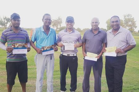 The winners pose with their vouchers. From left; Avinash Persaud, Patrick Prashad, Guillermo Escarraga, Patanjalee Persaud and Aleem Hussain.