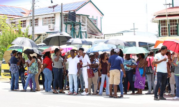 For more than four hours yesterday teachers from as far as East Berbice/Corentyne waited outside the Ministry of Education on Brickdam to hear the results of the negotiations between the Government of Guyana and the Guyana Teacher’s Union (GTU).  (Terrence Thompson photo)