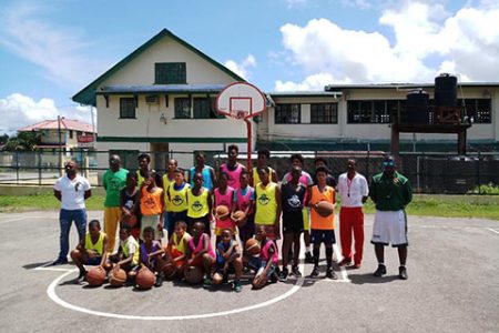 National Head-coach Junior Hercules (right) posing with participants of the training clinic at the Bartica Community Centre
