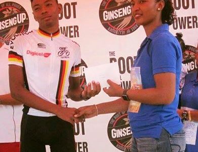 Christopher Griffith receiving the prize from the wife of the late Urban Benjamin
