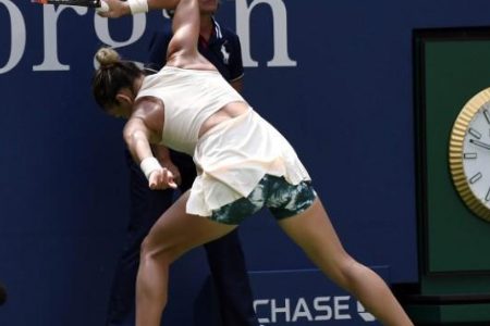 New York, NY, USA; Simona Halep of Romania smashes her racket on the ground during her loss to Kaia Kanepi of Estonia on day one of the 2018 U.S. Open tennis tournament at USTA Billie Jean King National Tennis Center. Mandatory Credit: Danielle Parhizkaran-USA TODAY Sports.
