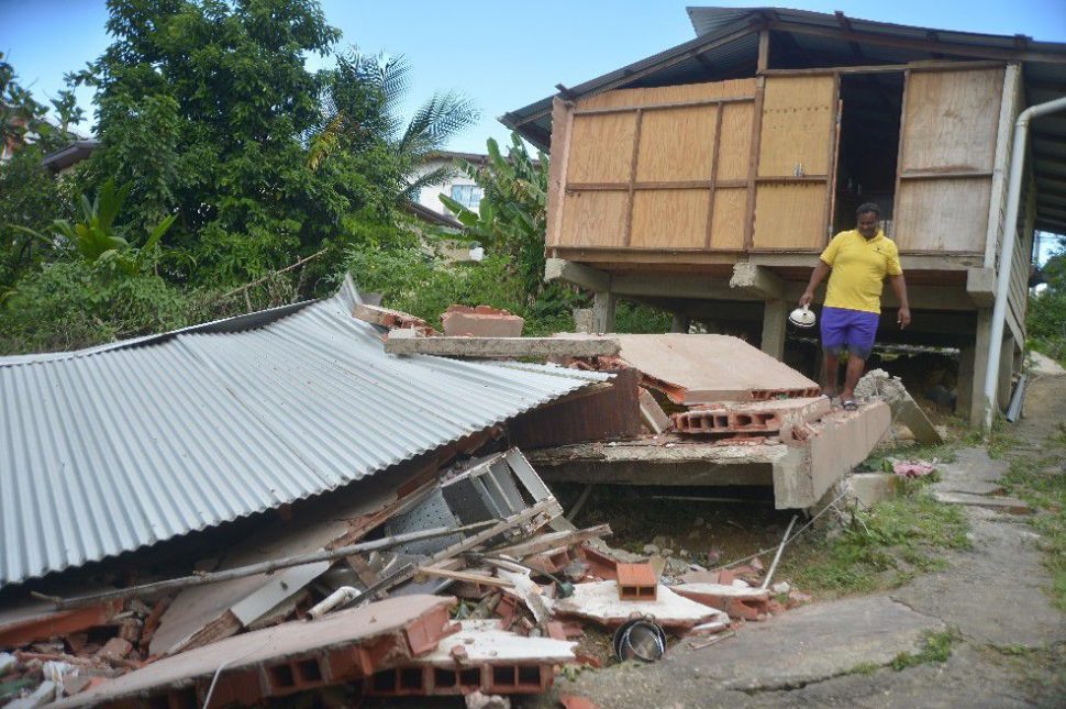 Carpenter Sudesh Deonarine surveys the damage to his home in Princes Town. (Photo: TRINIDAD EXPRESS / DEXTER PHILIP )