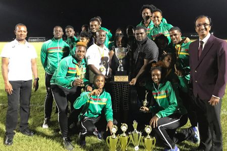 Triumphant University of Guyana (UG) team celebrate their historic triumph in the inaugural Brij Parasnath National College Athletics Championships at the Leonora National Track & Field Stadium.
Aubrey Hutson (President of AAG) is at extreme left is while Brij 