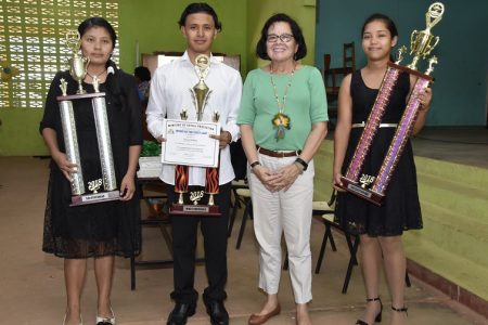 First Lady,  Sandra Granger (third from left) posed with, from left, ICT Salutatorian, Nikita James, Most Improved Student, Daniel Ruffino, and Valedictorian, Phabiula Rodrigues. (Ministry of the Presidency photo) 