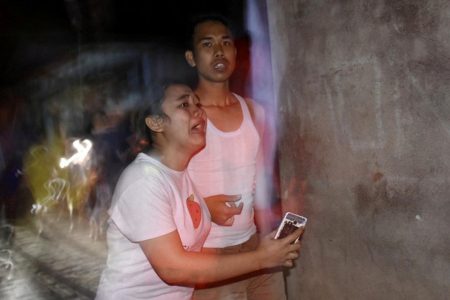 People react following an earthquake in Ampenan district, Mataram, Lombok, Indonesia August 5, 2018, in this photo taken by Antara Foto. Antara Foto/Ahmad Subaidi/ via REUTERS