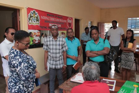 Minister Volda Lawrence (left) and her team interacting with a health worker in Princeville, Region Eight (DPI photo)