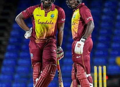 Andre Russell (left) and Rovman Powell enjoy a chat during their match-winning stand in the opening Twenty20 International against Bangladesh at Warner Park. (Photo courtesy CWI Media) 