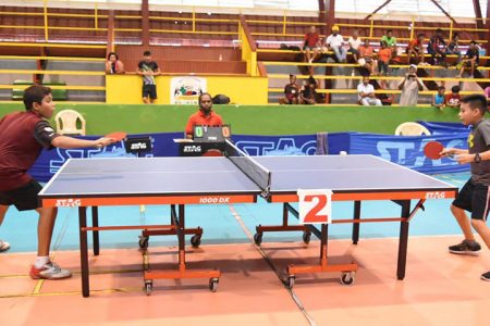 Jonathan Van Lange, left, in action against Colin Wong at this year’s national table tennis championships. (Royston Alkins photo)
