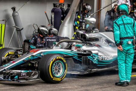 Mechanics work on the car of Mercedes’ Lewis Hamilton during race. Srdjan Suki/Pool via REUTERS

