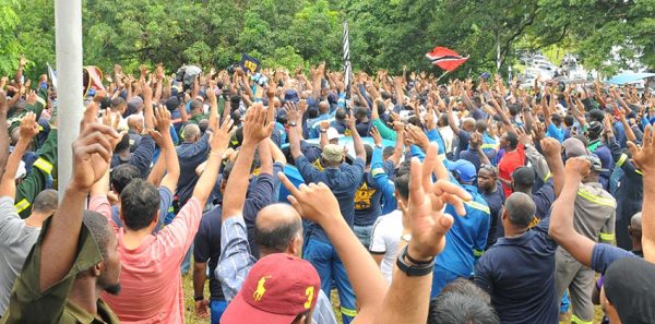 Petrotrin workers being addressed by OWTU president general Ancel Roget
