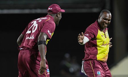 Captain Carlos Brathwaite (left) celebrates the first of Ashley Nurse’s two wickets with the bowler during the first Twenty20 International against Bangladesh. (Photo courtesy CWI Media)
