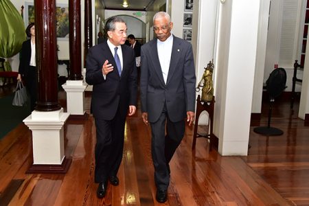 China’s State Councilor and Minister of Foreign Affairs Wang Yi speaking with President David Granger at State House yesterday. (Ministry of the Presidency photo)