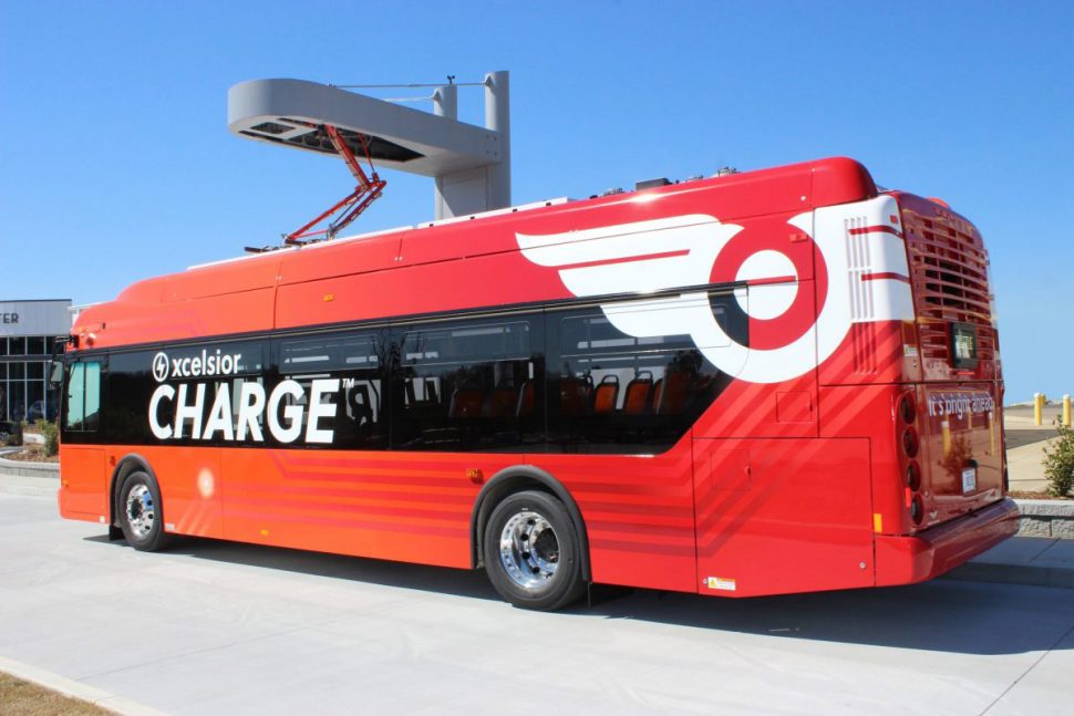 A representation of an electric bus docked at its charging station.