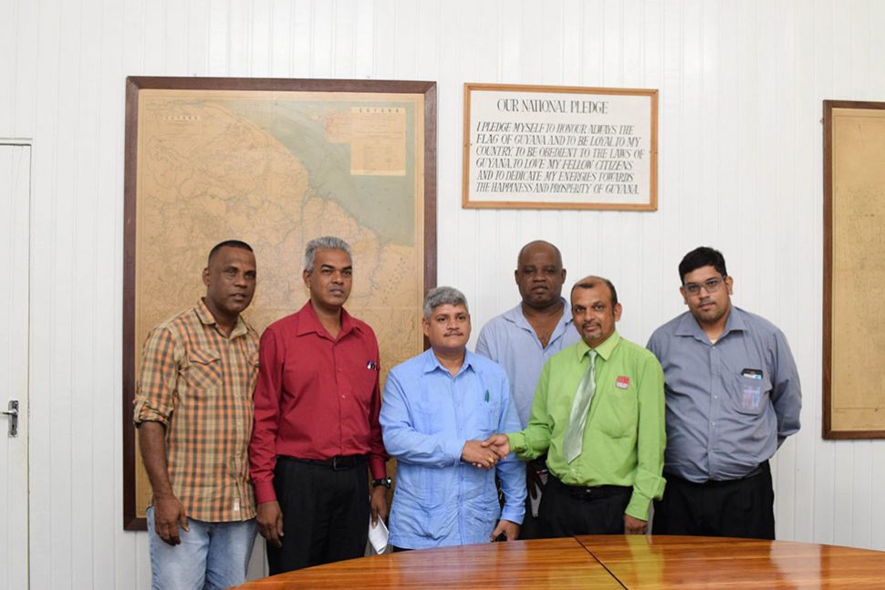 Minister within the Ministry of Finance Jaipaul Sharma (third, from left) and representatives of the Federation of Independent Trade Unions of Guyana (FITUG) during the consultation on Thursday. 