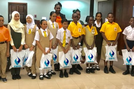  The Guyana Bank for Trade and Industry (GBTI) on Friday presented bursary awards to 15 students who performed well at this year’s National Grade Six Assessment. Those who received the bursary awards were the country’s top student at the examination Naila Rahaman, Virenda Dookie, Brendon Prince, Mariah Ellis, Sameya Khan, Deviani Ram, Malina Khan, Jazzmin Roopchand, Ziya Haniff, Sayid Stuart, Mikayla Hamer, Joel Benjamin, Elijah Rajak, Muhammed Baksh of the Anna Regina Branch and Tiffany Regis of Lethem.
The awardees are all members of GBTI’s Early Savers Club.  Some of the awardees can be seen in this photo.

