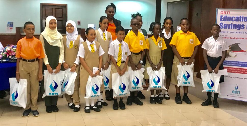  The Guyana Bank for Trade and Industry (GBTI) on Friday presented bursary awards to 15 students who performed well at this year’s National Grade Six Assessment. Those who received the bursary awards were the country’s top student at the examination Naila Rahaman, Virenda Dookie, Brendon Prince, Mariah Ellis, Sameya Khan, Deviani Ram, Malina Khan, Jazzmin Roopchand, Ziya Haniff, Sayid Stuart, Mikayla Hamer, Joel Benjamin, Elijah Rajak, Muhammed Baksh of the Anna Regina Branch and Tiffany Regis of Lethem. 
The awardees are all members of GBTI’s Early Savers Club.  Some of the awardees can be seen in this photo.
