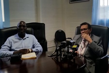 Deputy Chairman of the Local Government Commission, Andrew Garnett (left) and former Chancellor Justice Cecil Kennard addressing reporters at the LGC’s Eping Avenue office yesterday. 