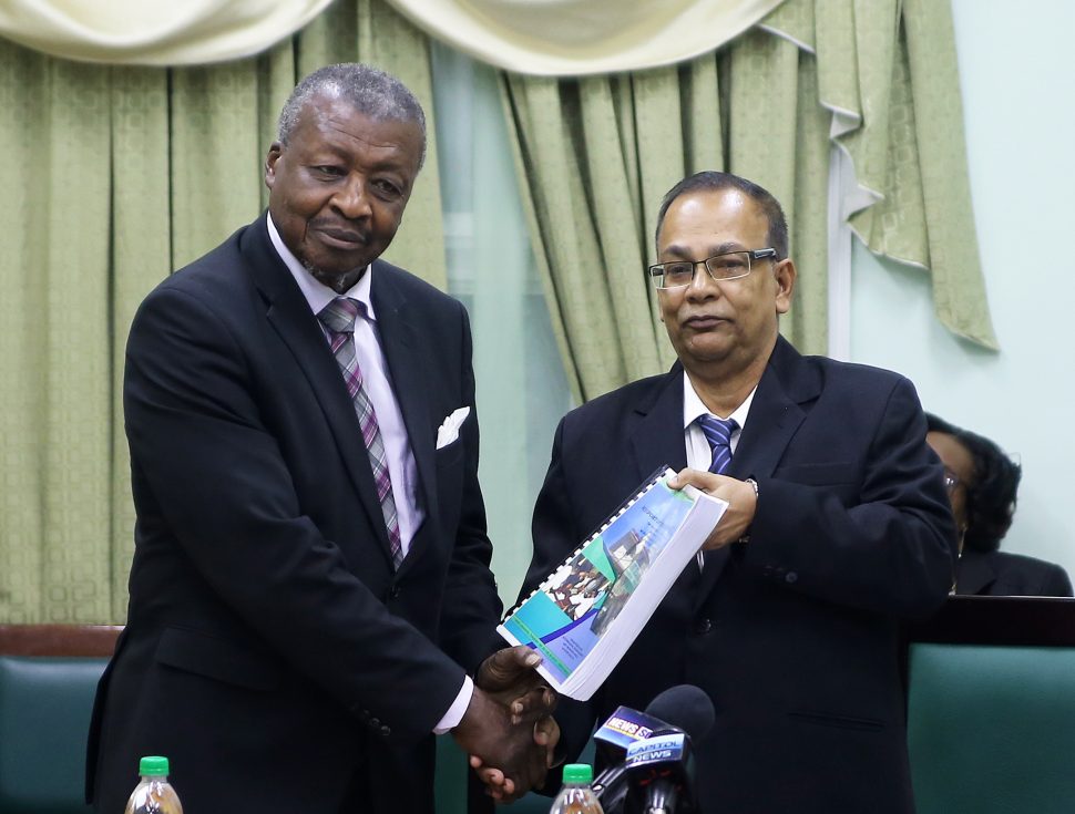 Speaker of the National Assembly Dr. Barton Scotland (left) accepting the 2017 Auditor General’s Report from Auditor General Deodat Sharma at the Public Buildings yesterday. The document will be made public after being laid in Parliament sometime after the recess ends on October 10th. (Photo by Terrence Thompson)