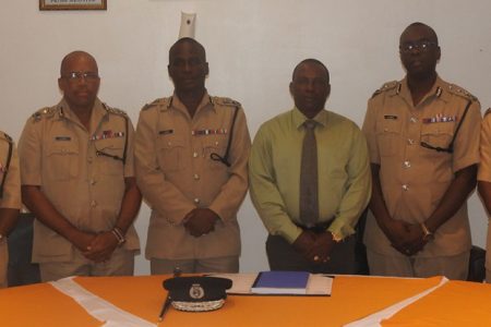 Commissioner of Police Leslie James (third, from left) with several senior members of the Guyana Police Force following the meeting. Also in picture are: three of the appointed Deputy Commissioners Nigel Hoppie (second, from right), Lyndon Alves (second, from left), and Paul Williams (third, from right). Also in picture is Commander of A Division Marlon Chapman (at right) and Assistant Commissioner of Police Clifton Hicken (at left). (Guyana Police Force photo)