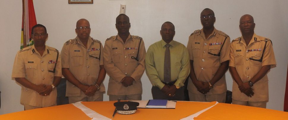 Commissioner of Police Leslie James (third, from left) with several senior members of the Guyana Police Force following the meeting. Also in picture are: three of the appointed Deputy Commissioners Nigel Hoppie (second, from right), Lyndon Alves (second, from left), and Paul Williams (third, from right). Also in picture is Commander of A Division Marlon Chapman (at right) and Assistant Commissioner of Police Clifton Hicken (at left). (Guyana Police Force photo)


