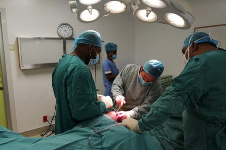 Dr.  Zou  Guoyou (centre) and other surgeons from the Orthopaedic Department of the GPHC during the surgery. 