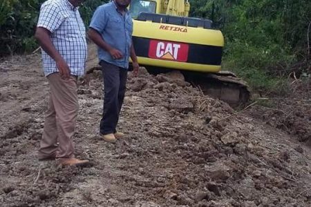Vice Chairman of Region Six, Denis Deroop (at left) checking on works being carried out on the Molson Creek road 