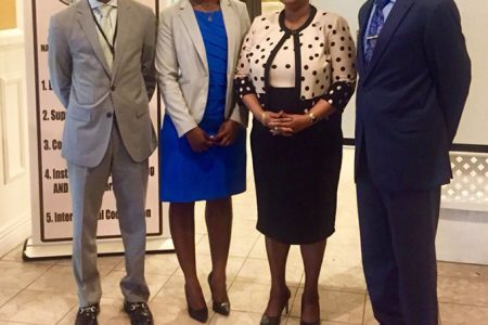 NANA Head Michael Atherley (at right) and Minister of Public Health Volda Lawrence (second, from right) at the launch of the report yesterday at the Georgetown Club. (NANA photo)

