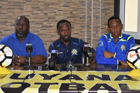 Ahmed Mohamed (center), Head-Coach and Technical Director of the Barbados Men’s National Football Team, makes a point during a pre-match press conference ahead of his team’s CONCACAF Nations League clash with Guyana. Also in the picture is player Hadan Holligan (right) and Martin Newton, Manager of the Team.