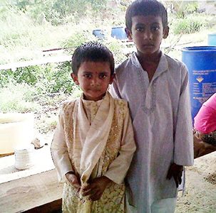 BEST FRIENDS: Brothers Narad, left, and Shalma Motilal at their Kernaham Village, Manzanilla, home. Shalma died from inhaling toxic fumes.