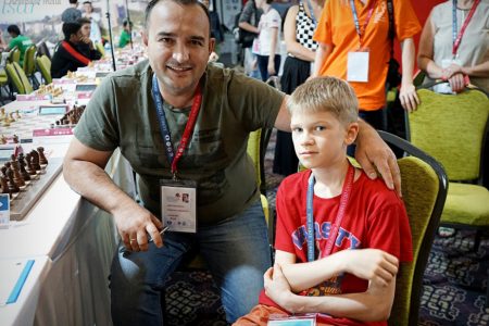 The 2018 World Junior Championships are underway in Gebze, Turkey, and one participant is 12-year-old Volodir Murzhin from Russia. Murzhin (right) is photographed with coach of the Russian junior chess team Grandmaster Farrukh Amonatov, who considers Murzhin a big talent since he won the European Championship for Boys Under-12 recently. (Photo: Amruta Mokal)
