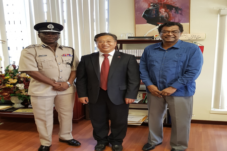 From left are Commissioner of Police Leslie James, China’s Ambassador Cui Jianchun and Minister of Public Security  Khemraj Ramjattan.