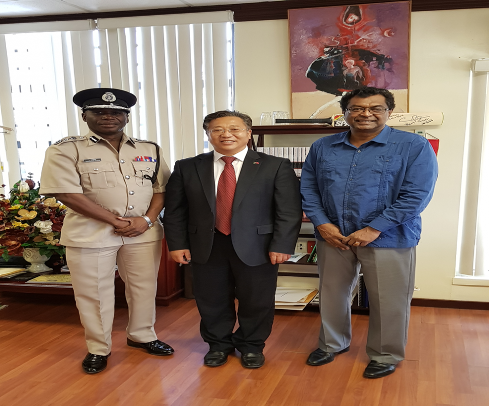 From left are Commissioner of Police Leslie James, China’s Ambassador Cui Jianchun and Minister of Public Security  Khemraj Ramjattan.