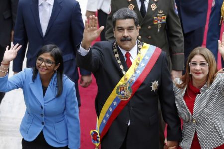 Venezuela's President Nicolas Maduro, then Constituent National Assembly President Delcy Rodriguez, left, and first lady Cilia Flores, wave as they arrive to the National Assembly, in Caracas, Venezuela, May 24, 2018. The Trump administration slapped financial sanctions Tuesday, Sept. 25, 2018, on four members of Maduro’s inner circle, including his wife, and Rodriguez who is now the nation’s vice president, on allegations of corruption.