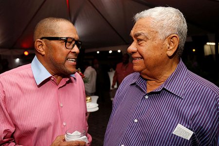 Lawrence Duprey (right) in discussion with businessman Carlos John last year 