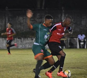 FLASHBACK!Ryan Hackett [center] of Fruta Conquerors challenging Rawle Gittens of Milerock for possession of the ball during their clash at the GFC ground, Bourda in the GFF Elite League recently.