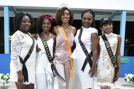 Reigning queen Romichelle Brumell, centre, with delegates of Miss Cultured Guyana 2018 on both sides.
