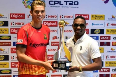All to play for! The two captains, Guyana Amazon Warriors’ Chris Green (left) and Trinbago Knight Riders’ Dwayne Bravo pose with the 2018 HERO CPL Trophy.
