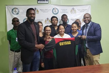 First from left front row Director of Sport, Christopher Jones the Guyana contingent with WCM Shariffa Ali (second from left), Sasha Shariff (center), Nellisha Johnson (second from right), President of the GCF James Bond, (back row from left) FM Wendell Meusa, WFM Maria Varona Thomas, CM Taffin Khan, Glenford Corlette and Loris Nathoo
