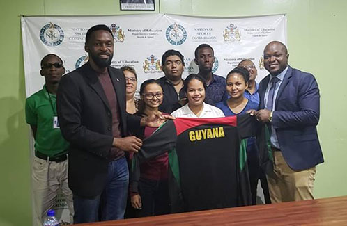 First from left front row Director of Sport, Christopher Jones the Guyana contingent with WCM Shariffa Ali (second from left), Sasha Shariff (center), Nellisha Johnson (second from right), President of the GCF James Bond, (back row from left) FM Wendell Meusa, WFM Maria Varona Thomas, CM Taffin Khan, Glenford Corlette and Loris Nathoo
