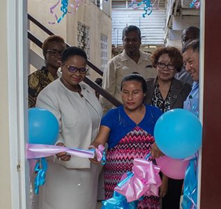 Minister of Public Health, Volda Lawrence (left)  and Minister of Indigenous Peoples’ Affairs, Sydney Allicock (right)  during the cutting of the ribbon to officially commission the Maternity Waiting Home at the Indigenous Residence, Princes Street, Georgetown. (DPI photo)