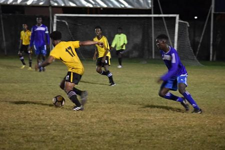 Western Tigers Goal Scorer Vurlon Mills [no.17] on the attack against NA United at the GFC ground in GFF Elite League