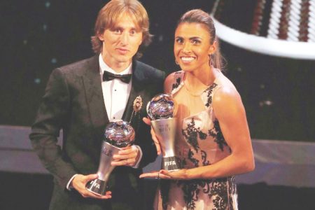 Luka Modric and Marta pose with their awards Action Images via Reuters/John Sibley
