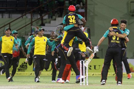 VICTORY RUSH!St. Kitts and Nevis Patriots players rush to the field after they won the match.
