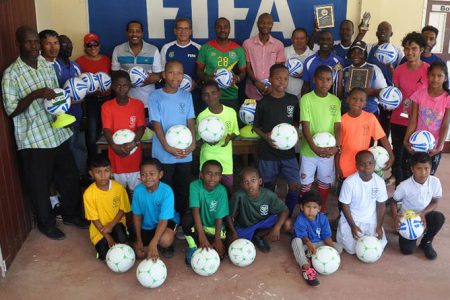 GFF President Wayne Forde alongside members of his executive and the EBFA, posing with players from the participating teams, following the launch of the 3rdAnnual Ralph Green sponsored East Bank Football Association [EBFA] Under-11 League
