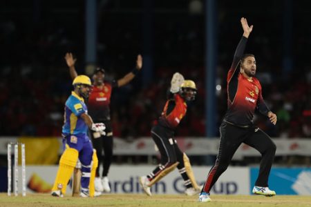 Fawad Ahmed (R), Denesh Ramdin (C), and Dwayne Bravo of Trinbago Knight Riders appeal unsuccessfully for the wicket of Sunny Sohal (L) of Barbados Tridents during the Hero Caribbean Premier League match between Trinbago Knight Riders and Barbados Tridents at Queen’s Park Oval on Friday in Port of Spain, Trinidad And Tobago. (Photo by Ashley Allen - CPL T20/Getty Images)

