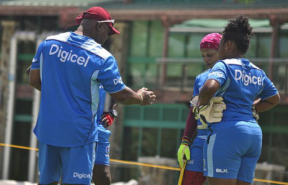 Head coach Hendy Springer (left) makes a point during a recent training camp.
