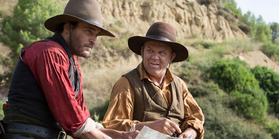 Joaquin Phoenix and John C Reilly in “The Sisters Brothers” (Image courtesy of TIFF)