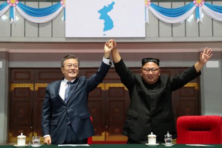 South Korean President Moon Jae-in (left) and North Korean leader Kim Jong Un acknowledges the audience after watching the performance titled “The Glorious Country” at the May Day Stadium in Pyongyang, North Korea, September 19, 2018. Pyeongyang Press Corps/Pool via REUTERS